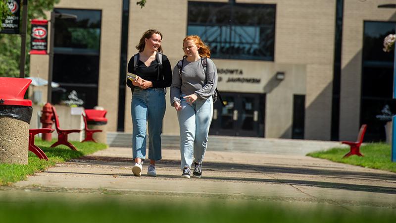 Students walking on sidewalk